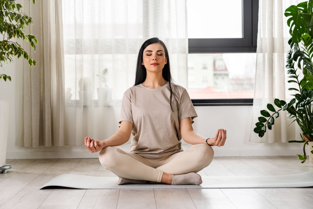 A woman meditating.